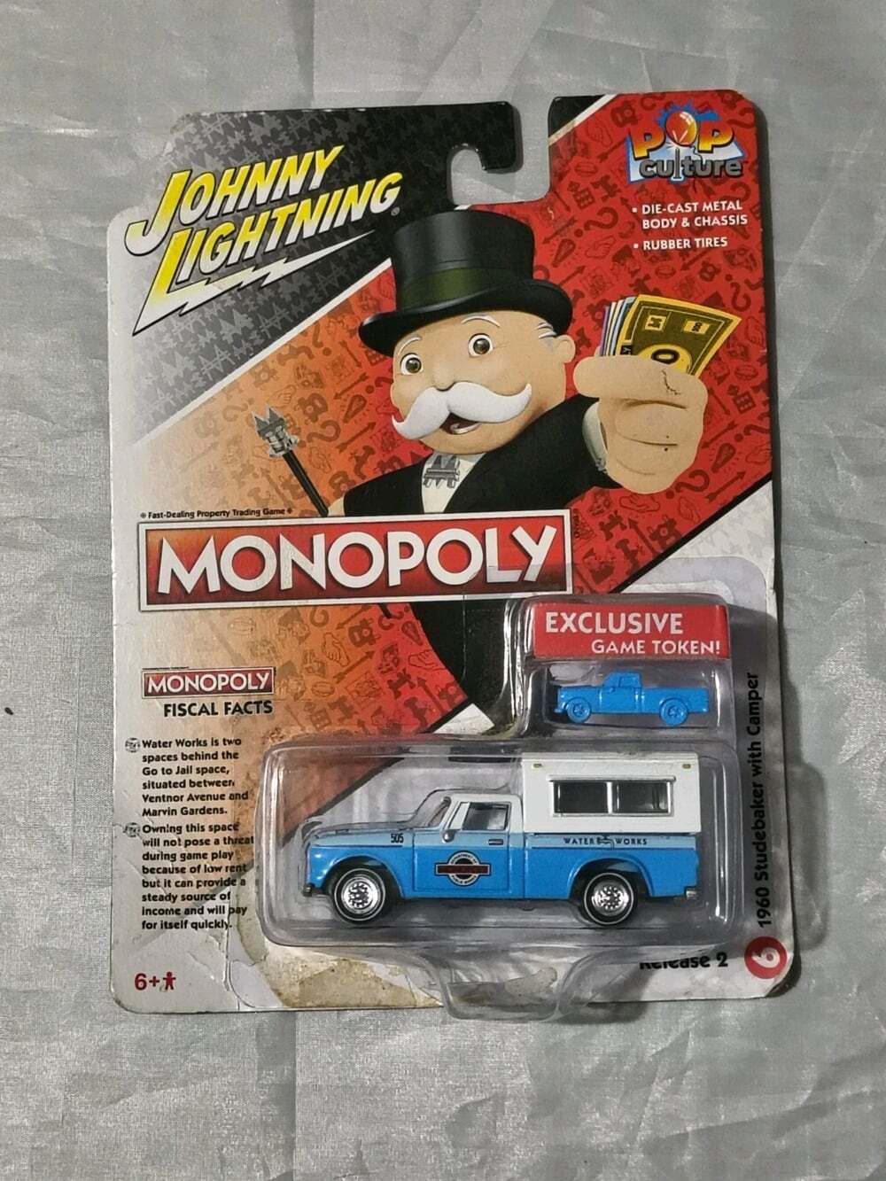 1960 STUDEBAKER PICKUP W/CAMPER "MONOPOLY" 1/64 JOHNNY LIGHTNING JLPC012-JLSP332